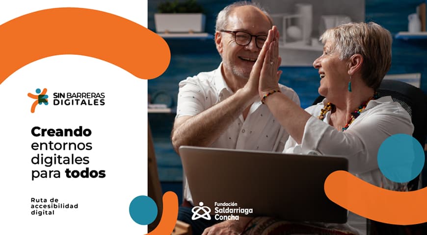 Una pareja de personas mayores chocan sus manos mientras trabajan con un computador portátil - Sin Barreras Digitales: Creando entornos digitales para todos - Ruta de accesibilidad digital
